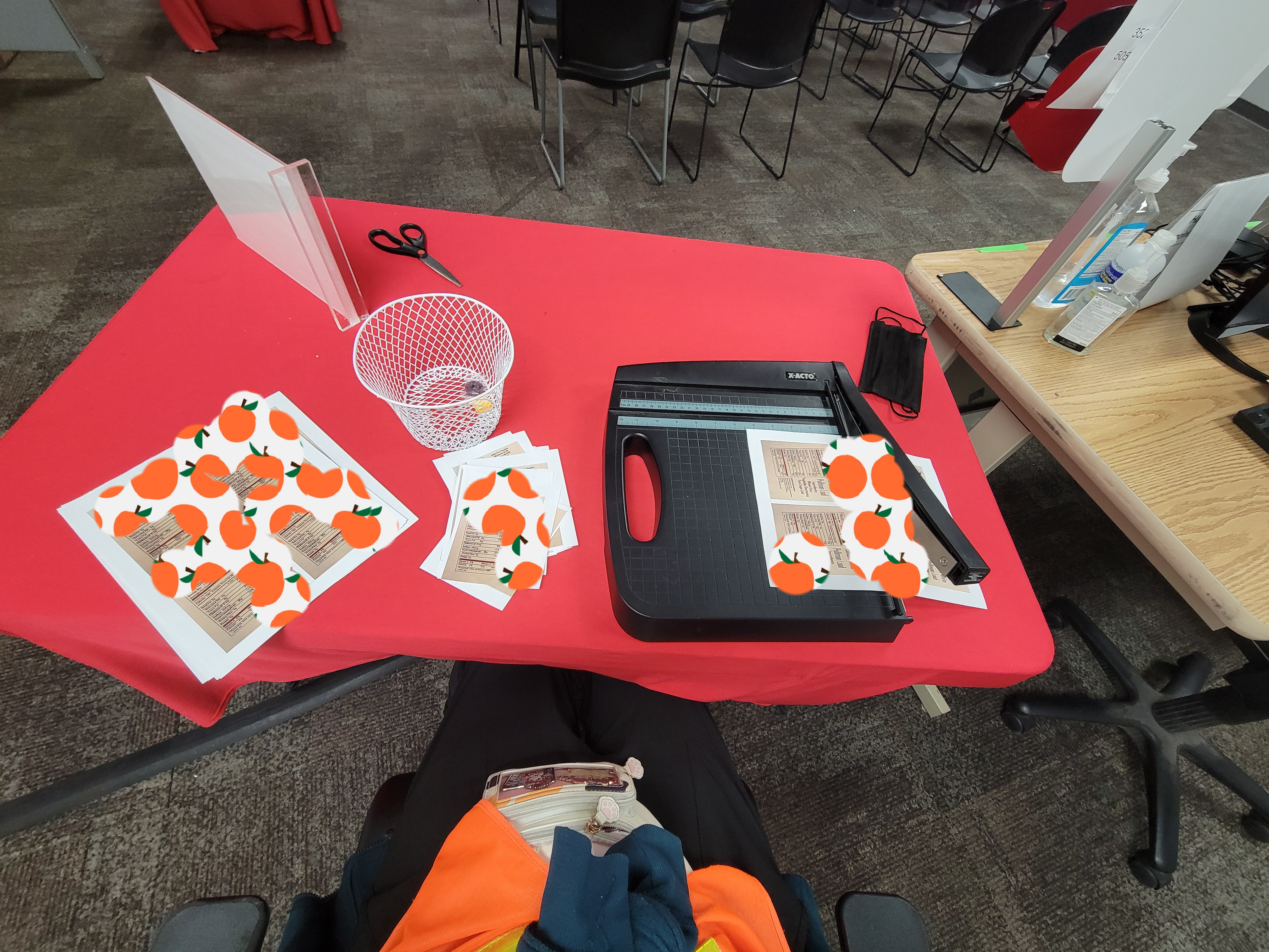 Labels and label cutter on table.